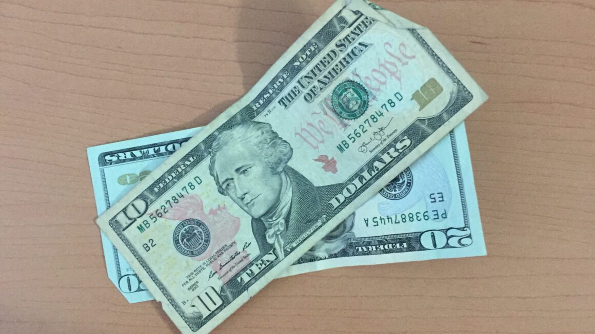 a $20 bill and a $10 bill
