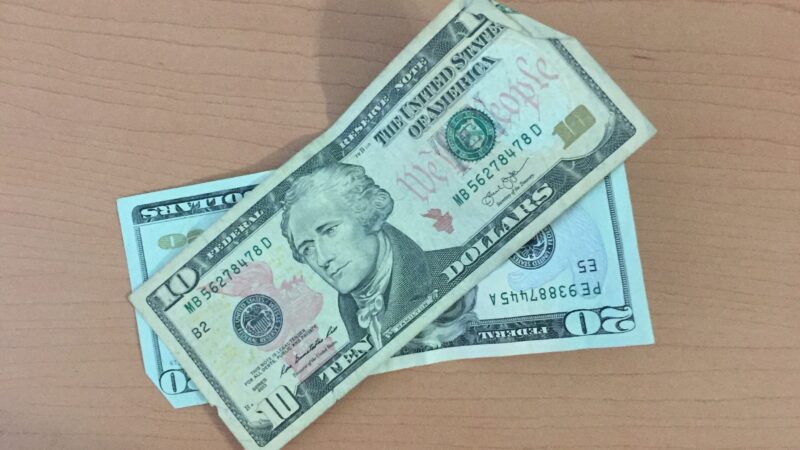 a $20 bill and a $10 bill