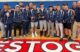 A group of high school wrestlers pose with their trophies after a successful tournament