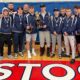 A group of high school wrestlers pose with their trophies after a successful tournament