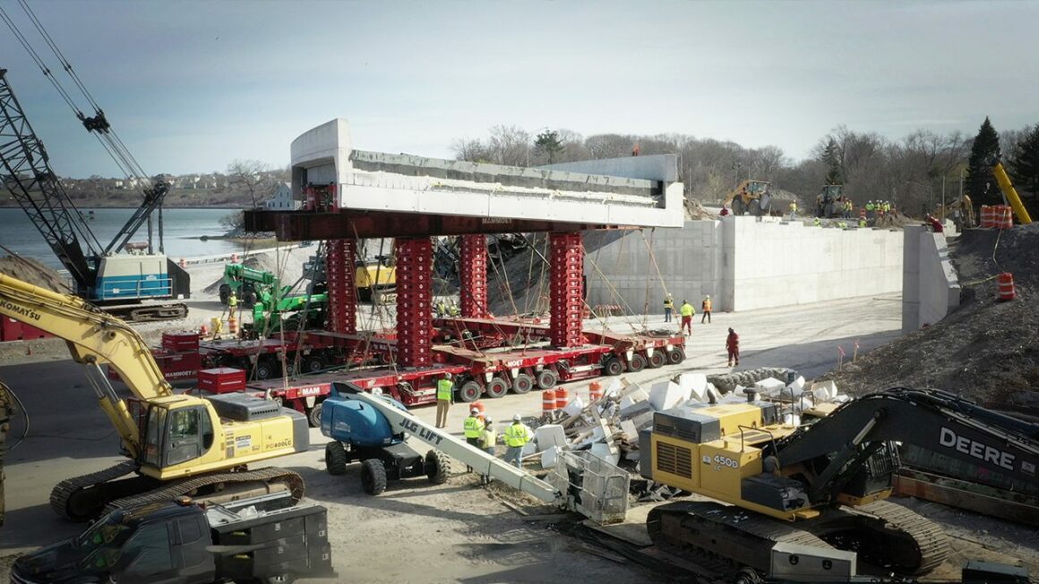 Construction crews work on installing a portion of the new bridge