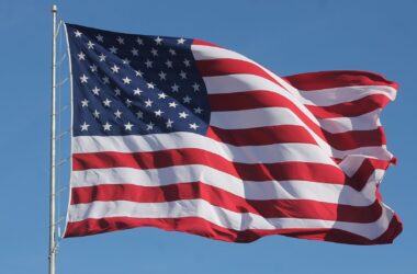 A U.S. flag waves in the wind