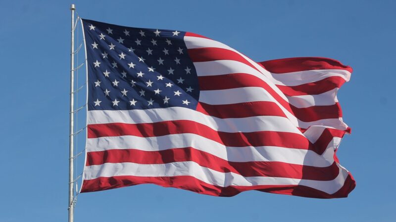 A U.S. flag waves in the wind