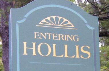 Sign along a roadway as you enter the Town of Hollis that reads ENTERING HOLLIS