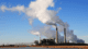 The coal-fired Cholla Power Plant with smoke arising from the plant