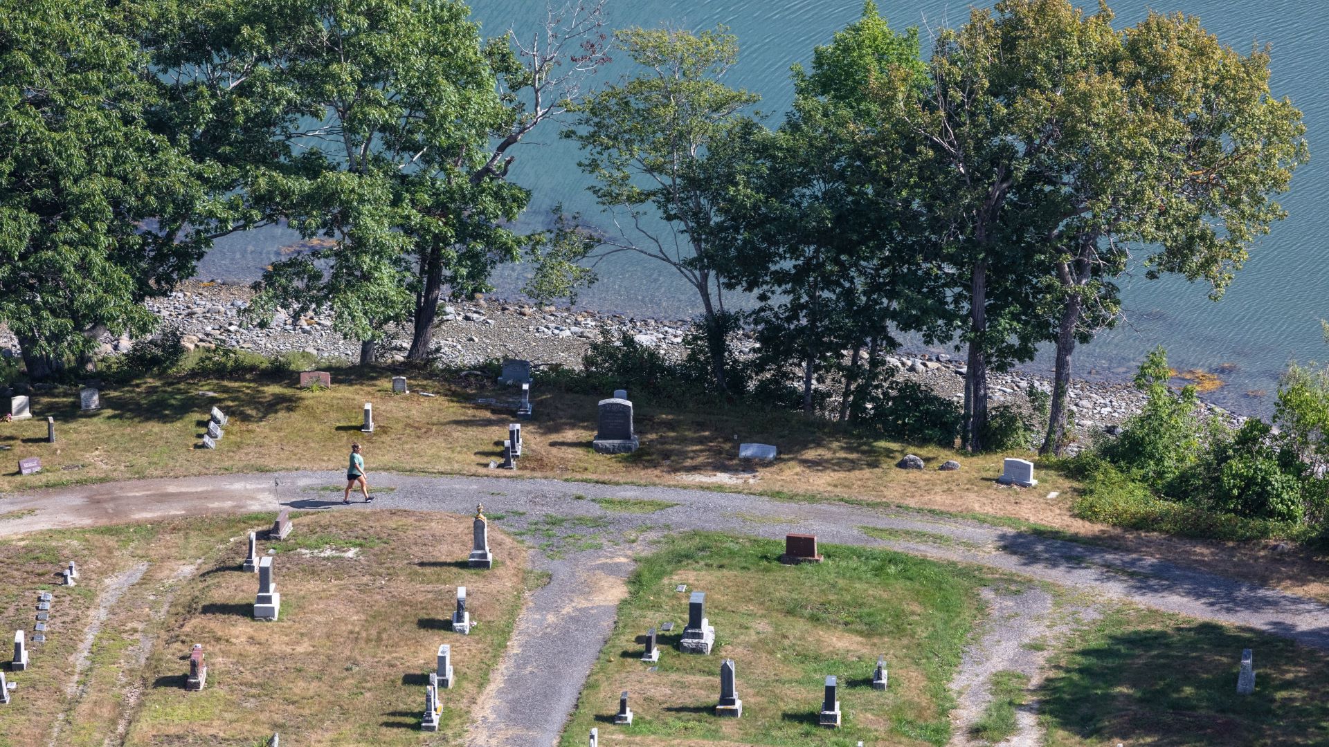 Aerial view showing grave sites that are at risk of collapsing into the ocean