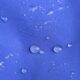 Droplets of rain on a blue rain jacket
