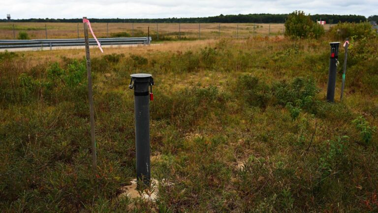 monitoring wells in an open field
