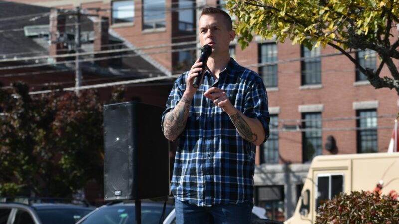 Jared Golden speaks on stage at the rally.