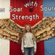 Rose Tuttle stands in front of the Sources of Strength eagle wings