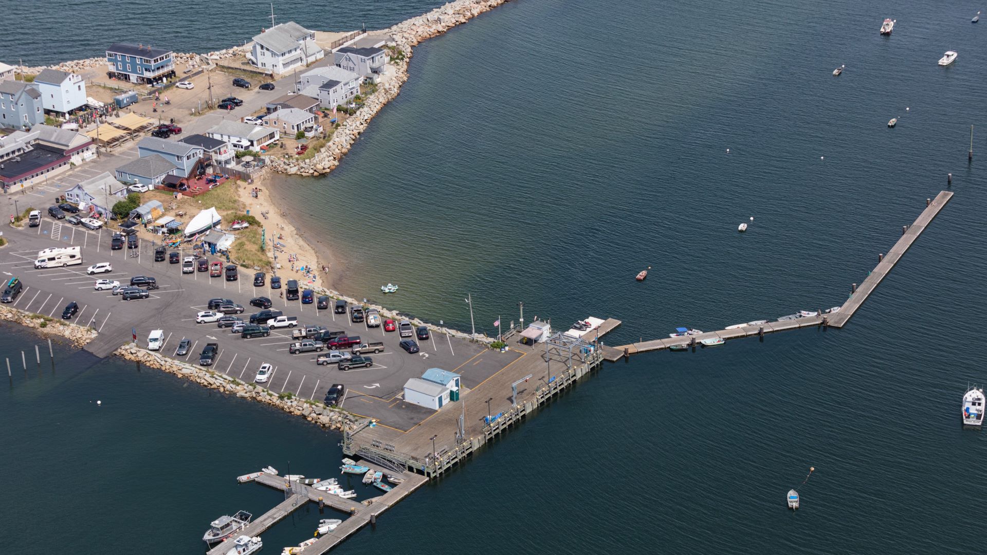 Aerial view of a parking that sits on the edge of the water in Saco