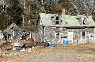 Exterior of a run-down, abandoned house.