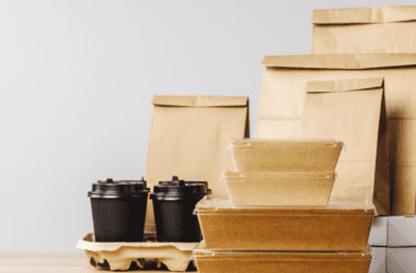 Several paper bags and takeout containers on a table