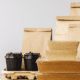 Several paper bags and takeout containers on a table
