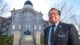 Jeff Evangelos stands in front of the State House