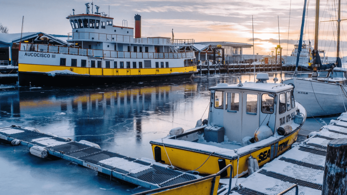 Boats docked in Portland, Maine during a snowy winter.