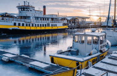 Boats docked in Portland, Maine during a snowy winter.