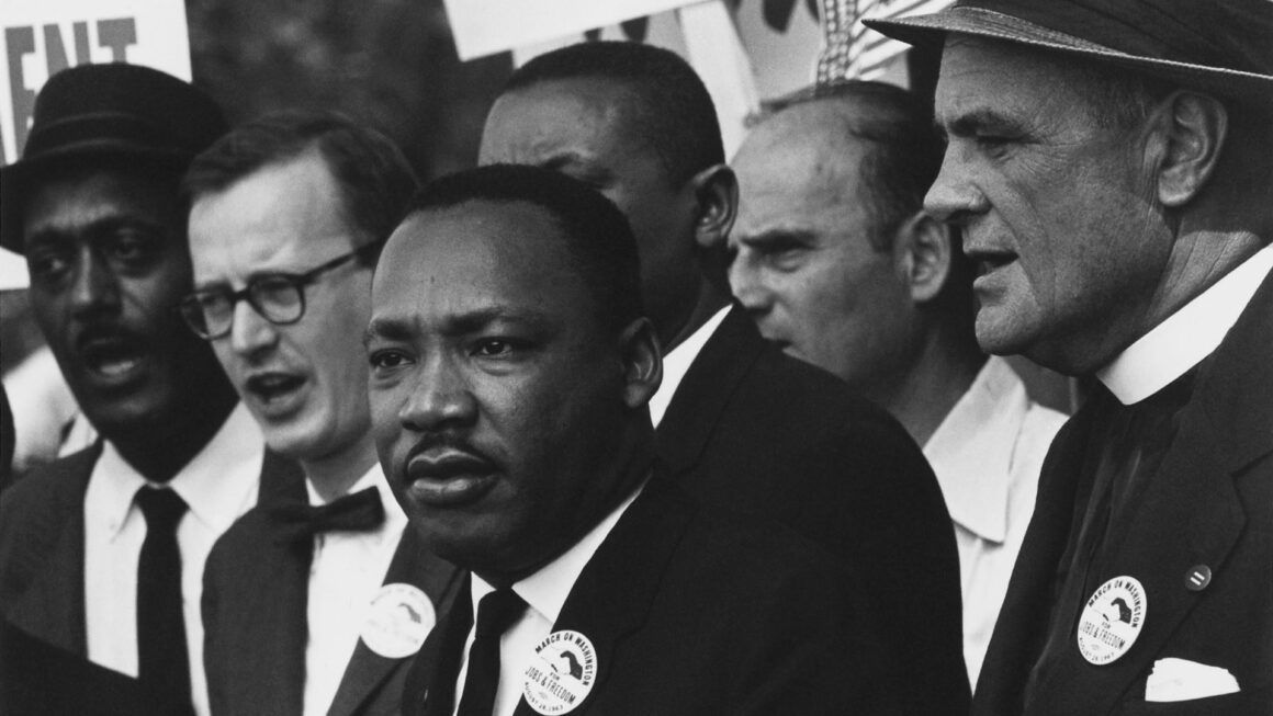 Martin Luther King, Jr. speaks to a crowd of supporters.