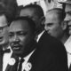 Martin Luther King, Jr. speaks to a crowd of supporters.