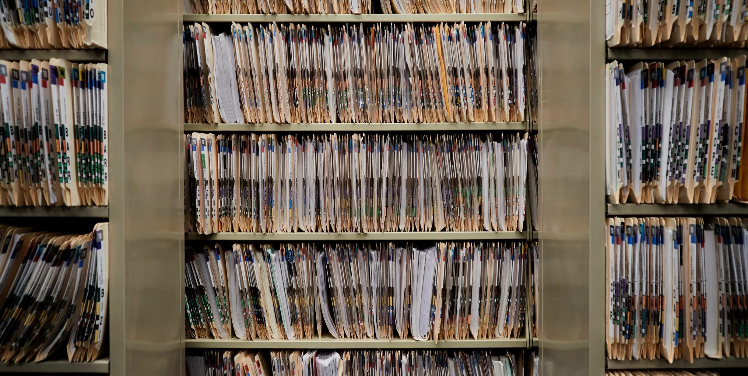 Shelves lined with numerous court case files.