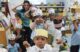 A classroom of Pre-K students dance to a song in a classroom.