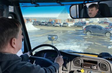 Elm Street School principal Tony Maker driving a school bus.