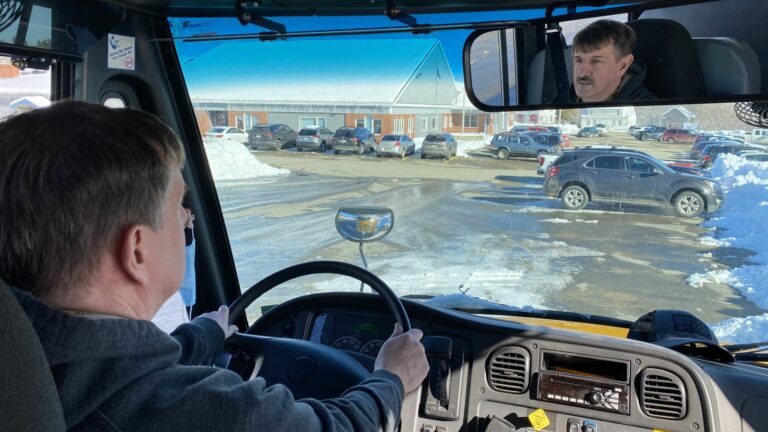 Elm Street School principal Tony Maker driving a school bus.