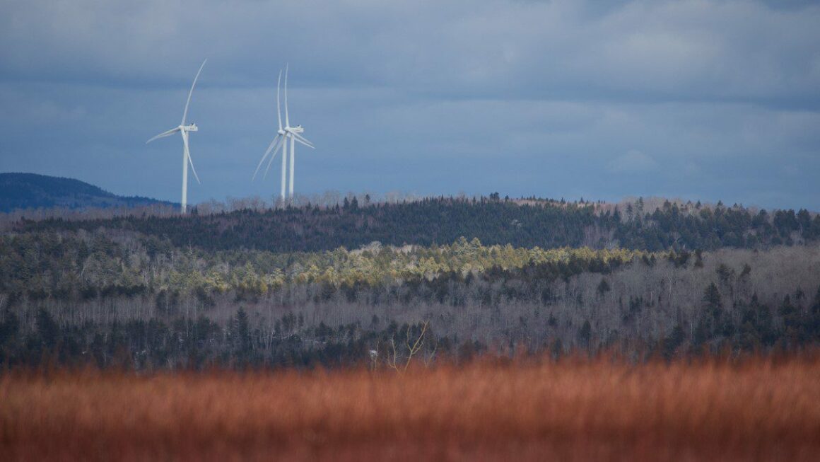 Wind turbines out in the distance in Hancock County.