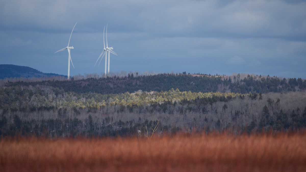 Wind turbines out in the distance in Hancock County.