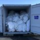 A trailer full of baled boat covers. 