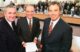 Irish Prime Minister Bertie Ahern, U.S. Senator George Mitchell and British Prime Minister Tony Blair pose for a photo after signing the Good Friday Agreement.