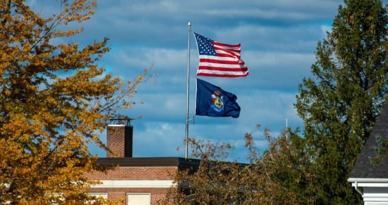 Flags fly over the University of Maine at Machias campus