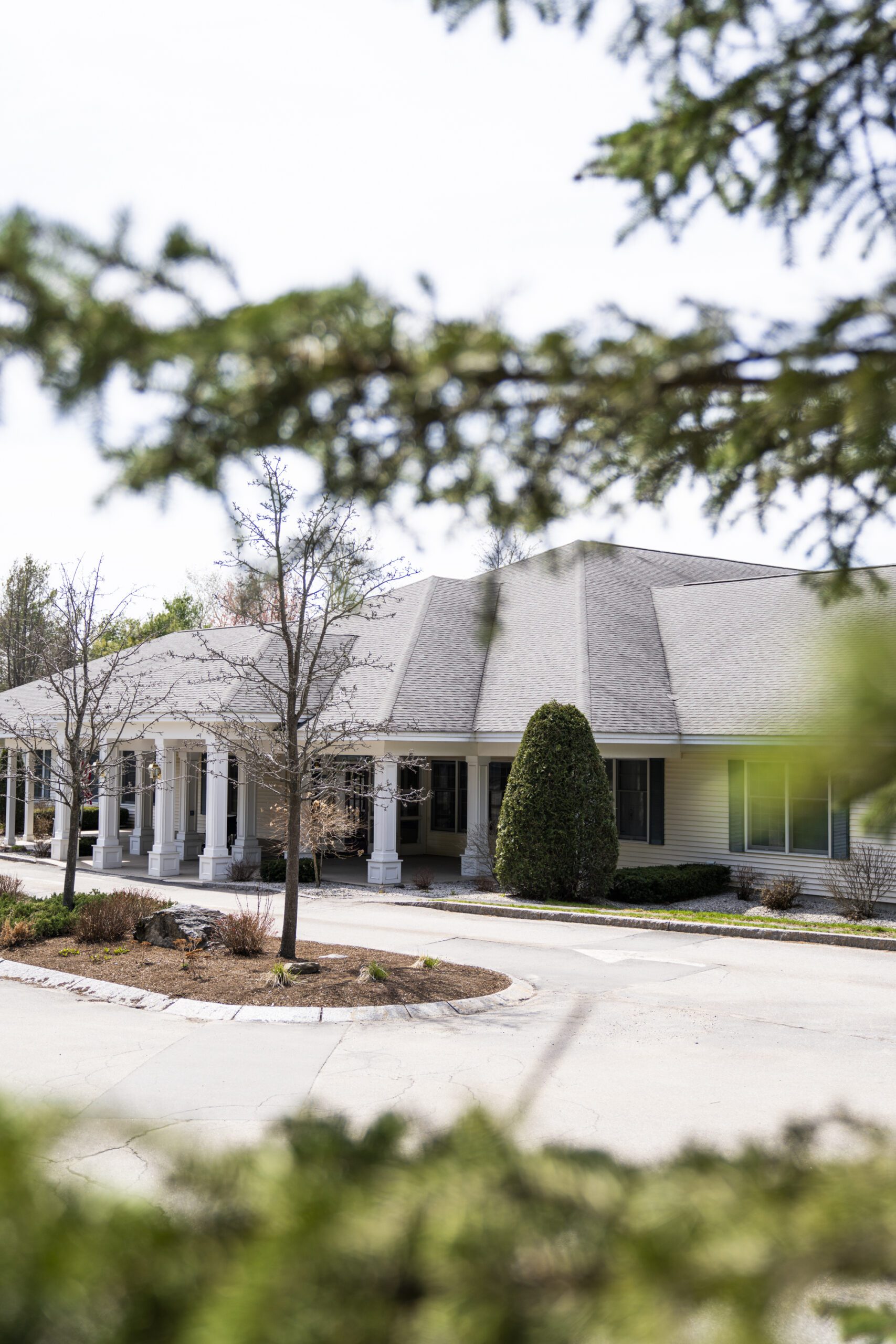 exterior of the woodlands facility in dedham