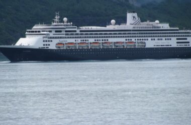 A cruise ship traveling through the open water.