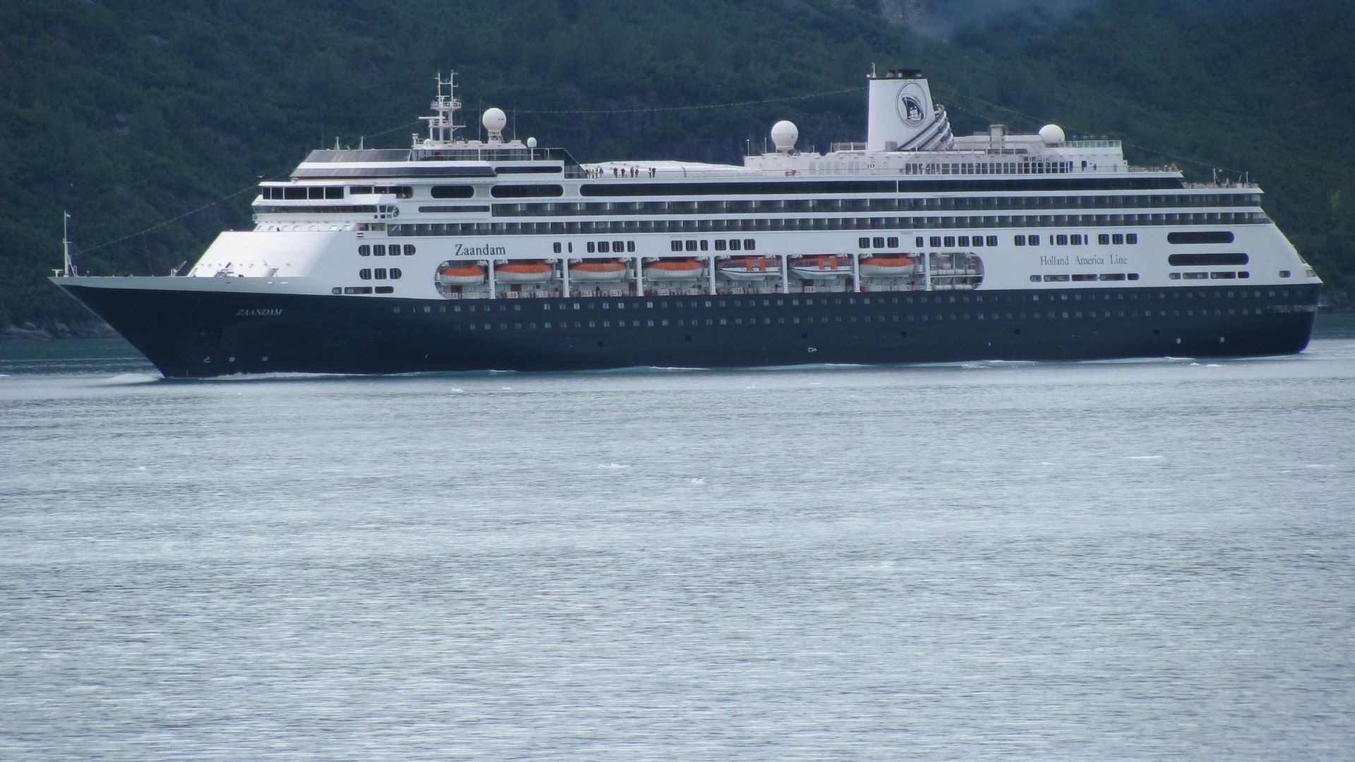 A cruise ship traveling through the open water.
