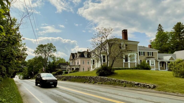 A car travels down a street in Cherryfield, Maine.