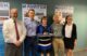 Senator Susan Collins poses for a group photo with Martin Kao and three other individuals.