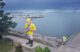 Aerial photo of a statue of a fisherman by the waters of Eastport.
