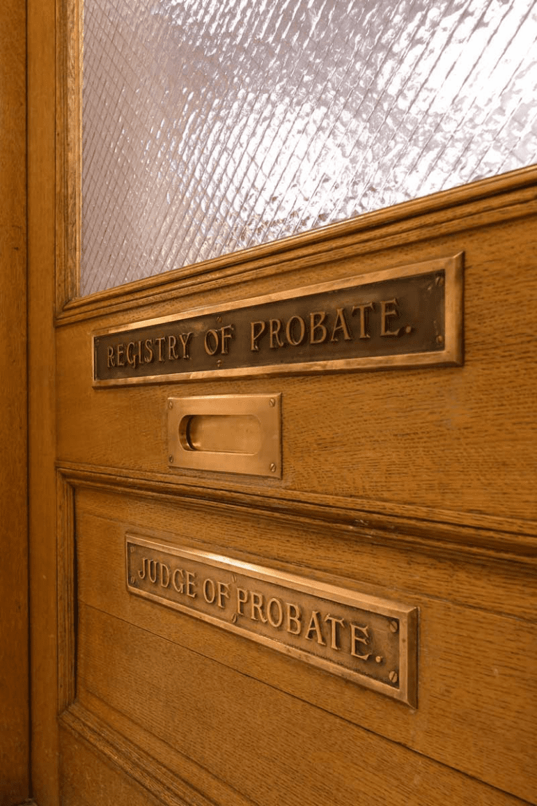 A brown door with plaques that read "Registry of Probate" and "Judge of Probate."
