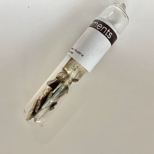 Lithium metal in a clear vial.