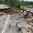 Heavy rains washed out a roadway and guardrails that went over a creek