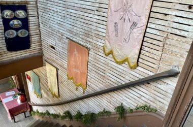 Banners line the wall of a staircase within Liberty Hall.