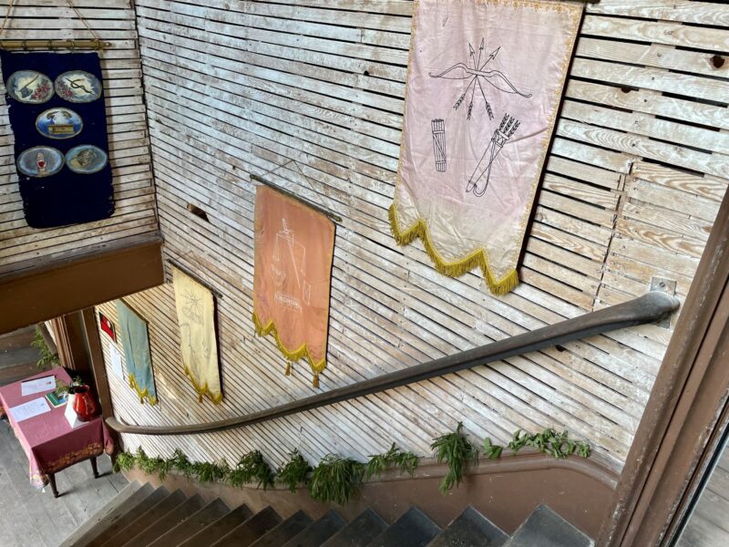 Banners line the wall of a staircase within Liberty Hall.