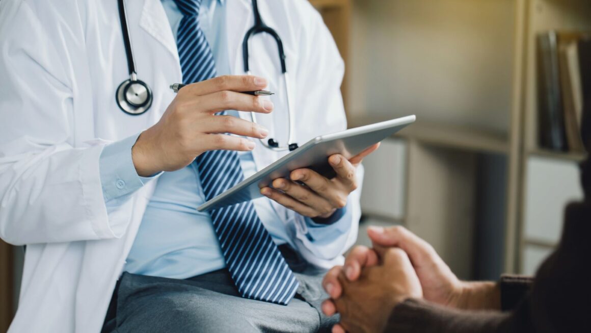 A doctor speaking with a patient.