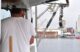 Chris Tobey looks to the water while on his lobster boat.