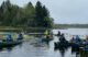 Young people on canoes in Reynolds Brook Marsh near Whiting, Maine.