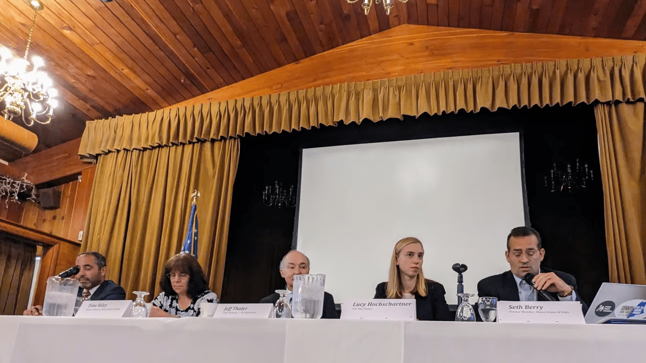 A view of the debaters on stage at the Question 3 forum.