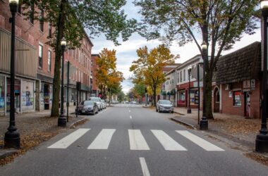 The streets and sidewalks of Lisbon Street in Lewiston are seen empty.