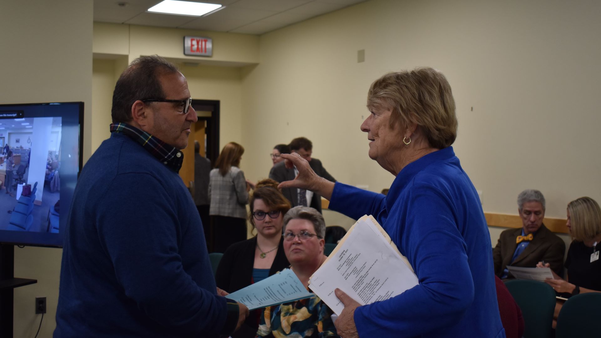 Joe Baldacci and Libby Mitchell chatting with one another.