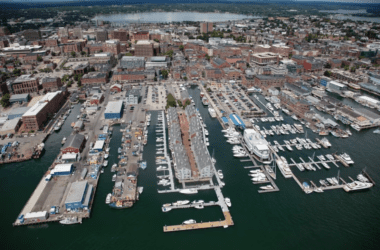 An aerial photo of Commercial Street and the waters surrounding the buildings of Portland.